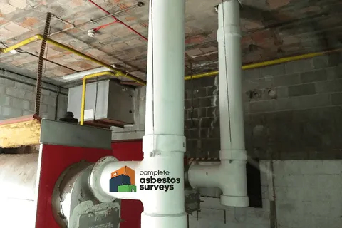 Encapsulated asbestos cement flue pipes