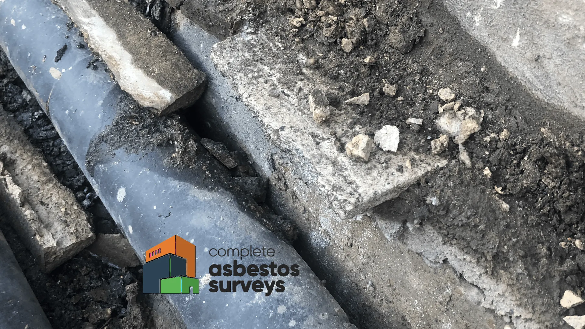 Asbestos Insulating Board Packer Within External Pipe Duct