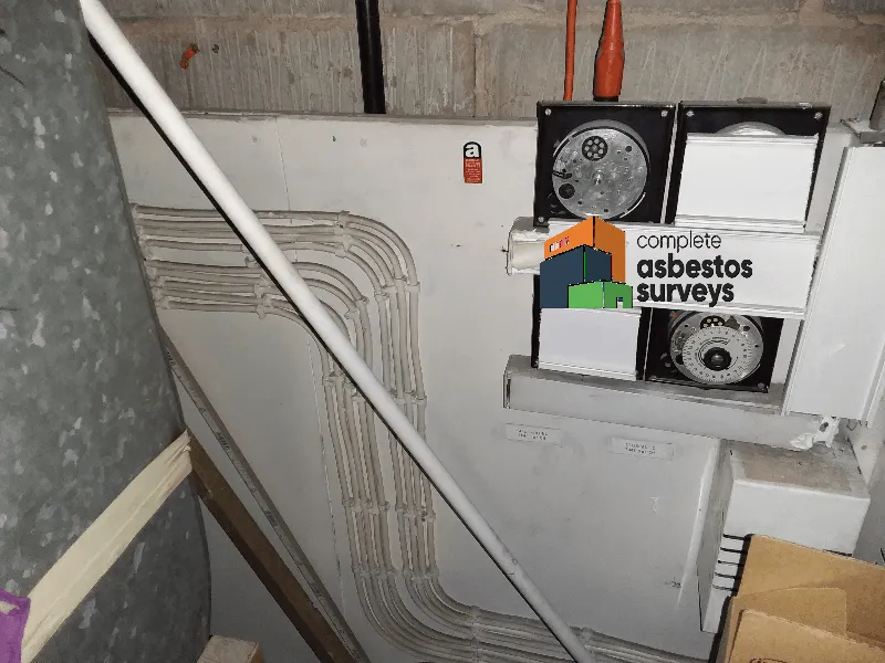 Asbestos Insulating Board Panel Behind Electrics