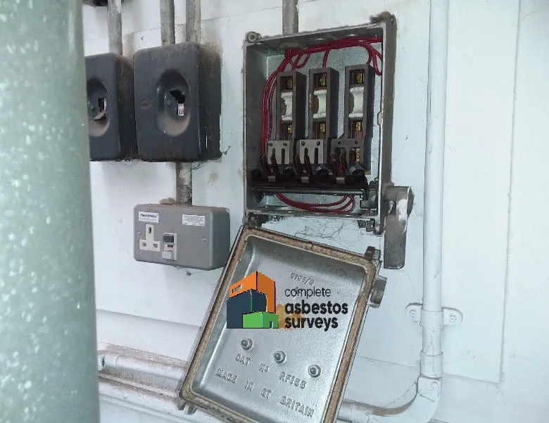 Asbestos Rope Seal Around Electrical Fuse Board