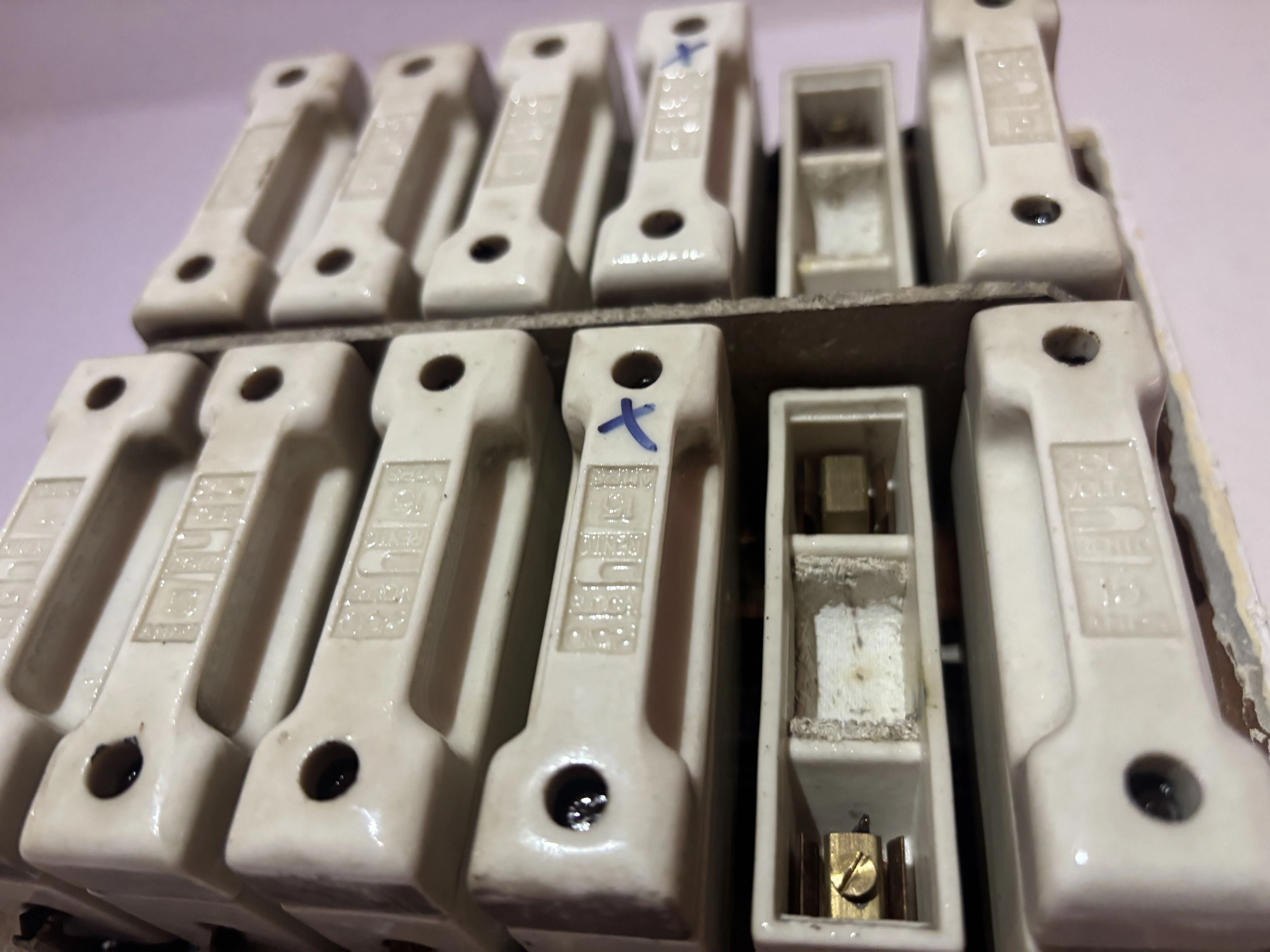 Asbestos fuse guards from domestic property