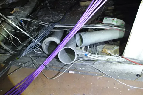 Redundant asbestos flue pipes in loft