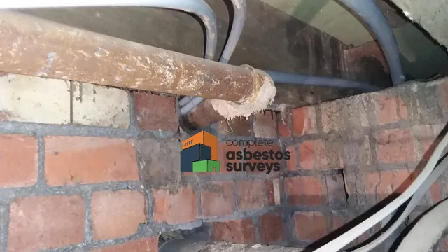 Asbestos Insulation to Pipe Work Under Floor