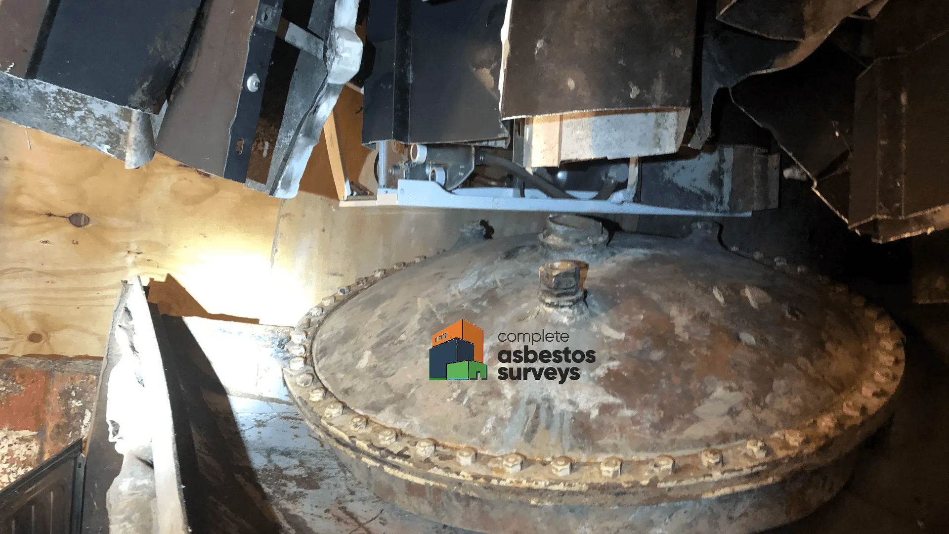 Asbestos Insulation Debris to Old Cylinder Lid