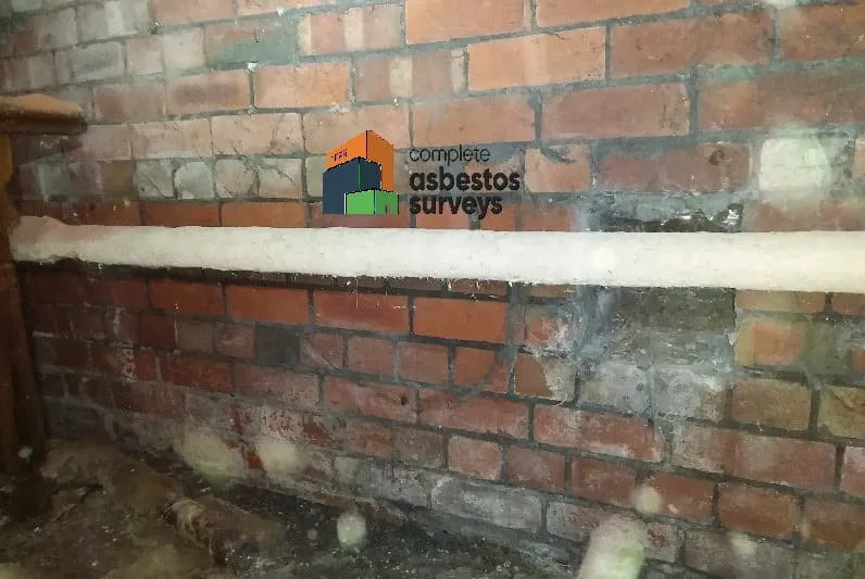 Asbestos Pipe Lagging on Pipe Under Floor of Church
