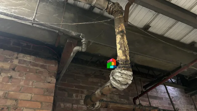 Asbestos Rope Wrapped on Pipe Bend as Insulation