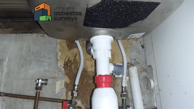 Asbestos Sink Pad in Cupboard