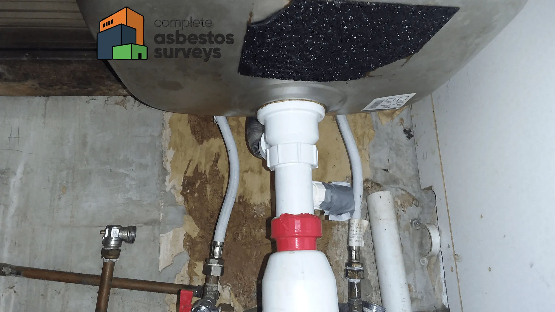 Asbestos Sink Pad in Cupboard