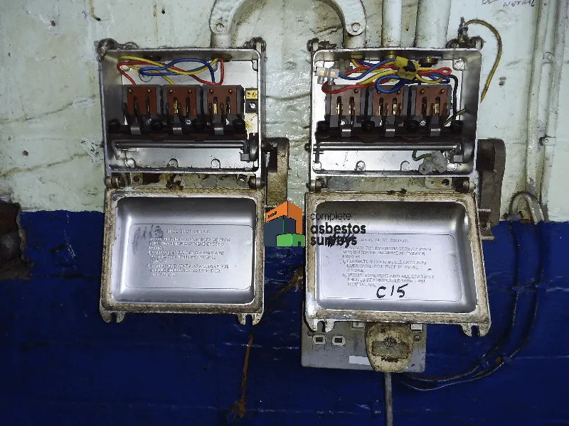 Asbestot Fuse Guards and Rope Seals to Redundant Fuse Boards in Old Factory