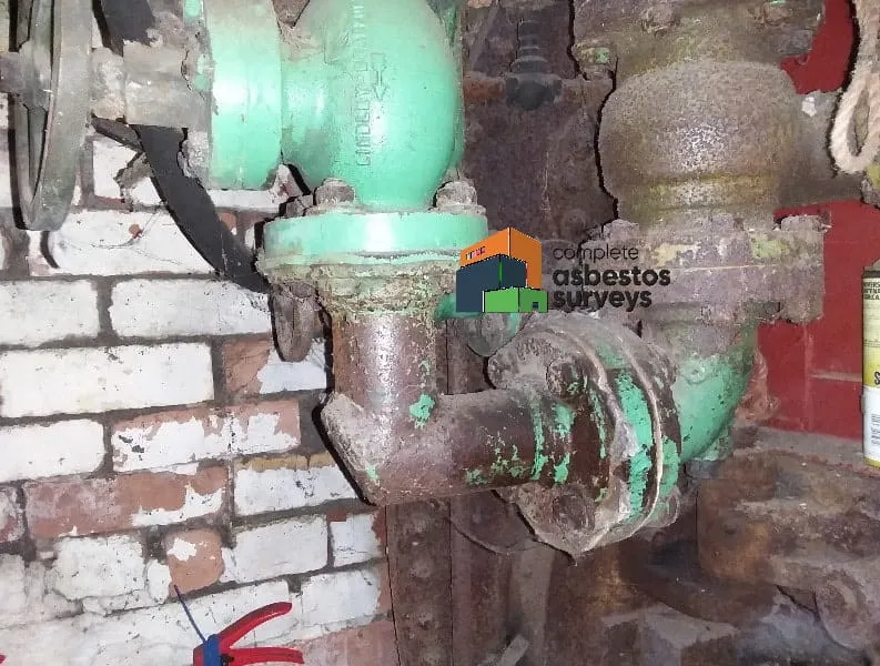 Asbestos Gasket to Pipe Flange in Boiler Room