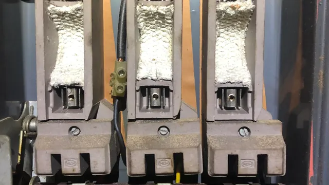 Woven asbestos fuse guards in electrical board to be removed