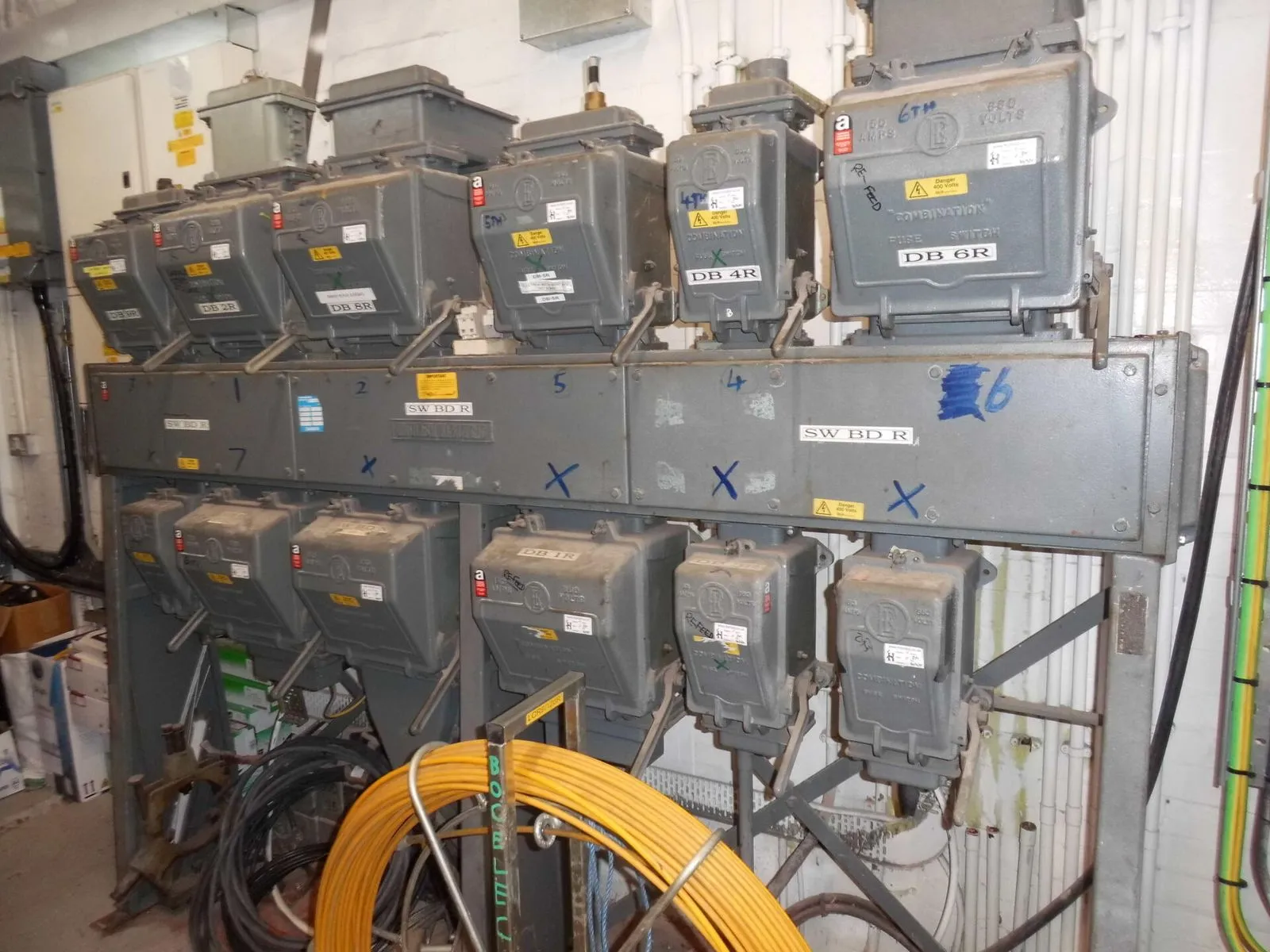 Electrical boards containing asbestos woven fuse guards in sub station