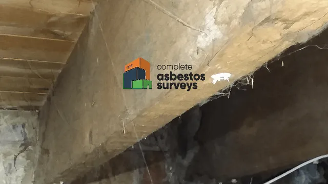 Debris From Old Asbestos Insulating Board Ceiling