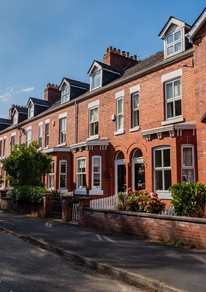 Street of red-brick Victorian terraced houses of the type commonly surveyed before purchase