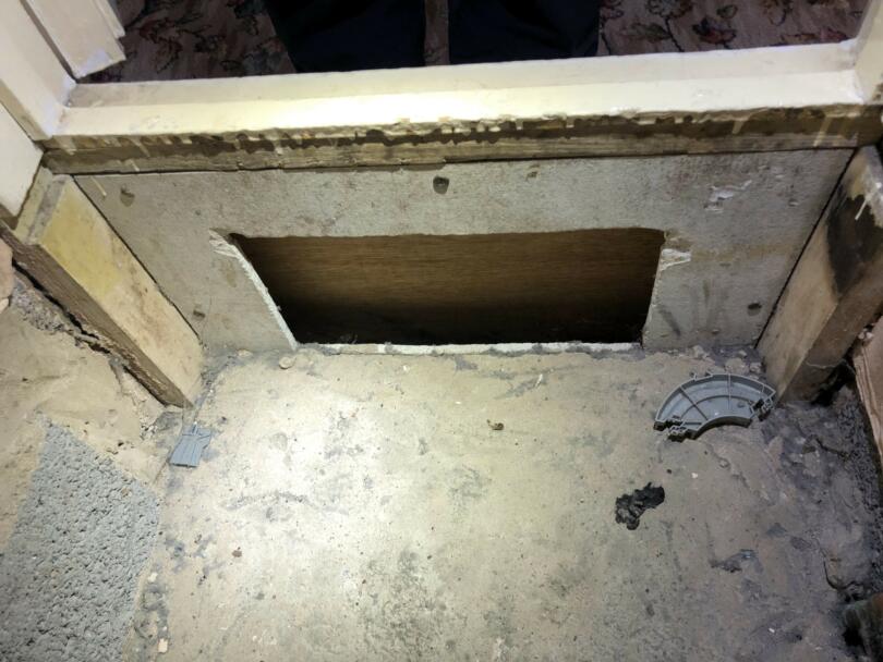Aib panel in boiler cupboard beneath door