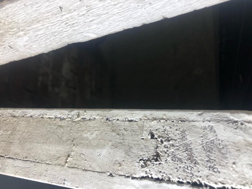 Top of asbestos insulating board lined fire door