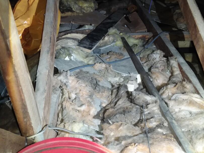 Asbestos cement debris within loft of industrial unit