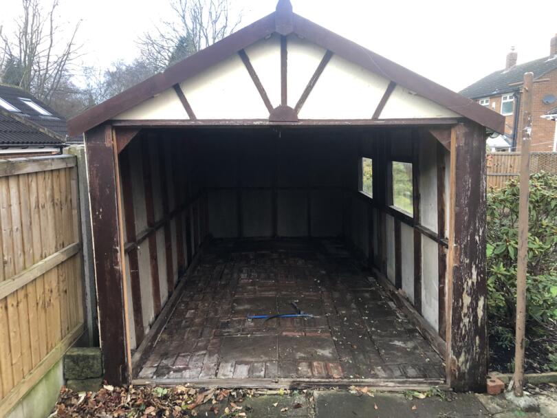 Asbestos cement garage with doors removed