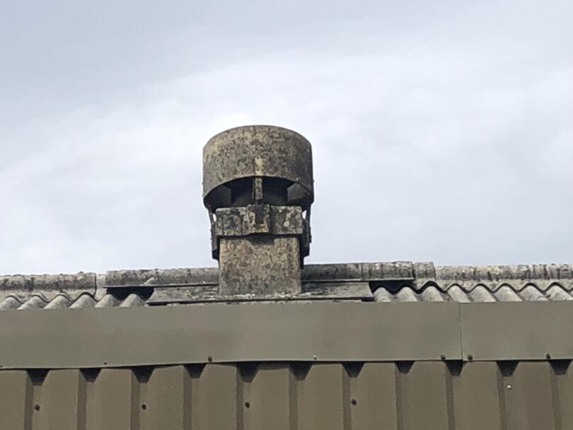 Large asbestos cement roof cowl on industrial unit