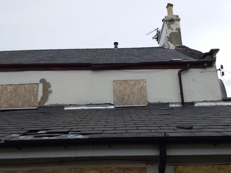 Asbestos cement roof tiles on former public house