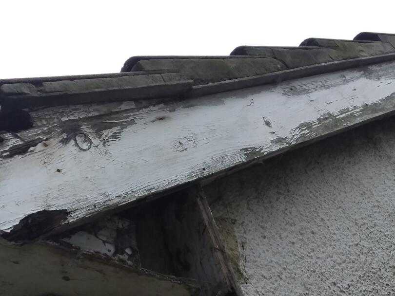 Asbestos cement under cloaking on gable ends of domestic property