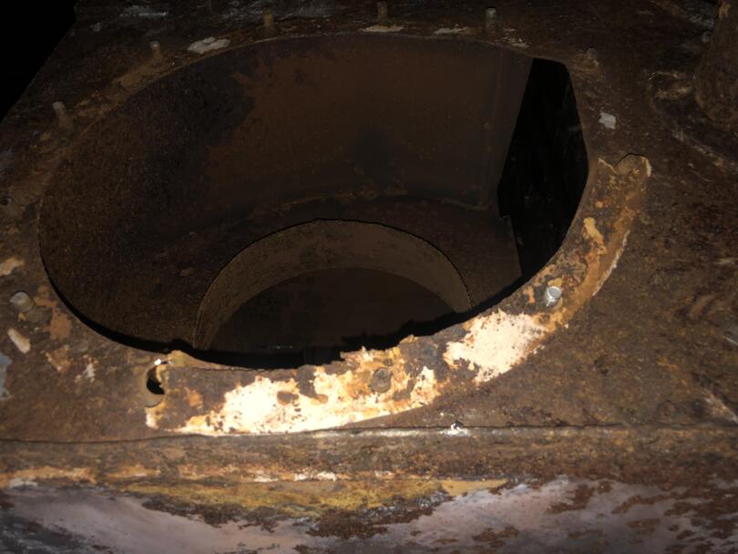 Asbestos gasket debris on old boiler fange