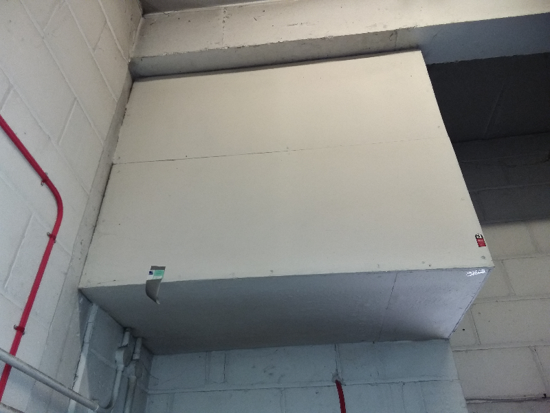 Asbestos insulating board boarding within lift room