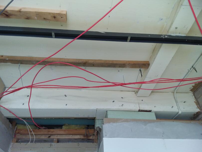 Asbestos insulating board ceiling and boxing panels above false ceiling