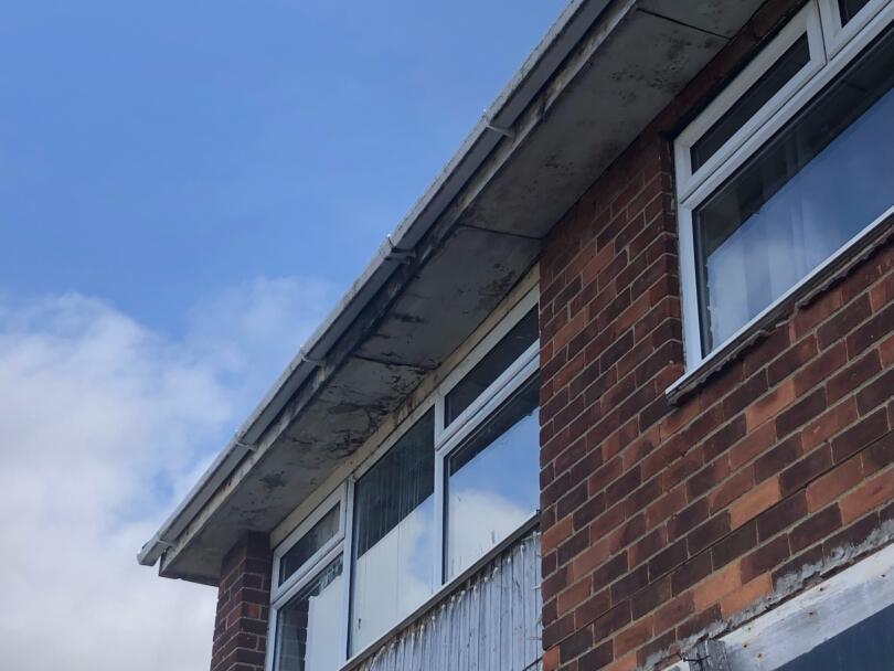 Asbestos insulating board external soffit boards on domestic property