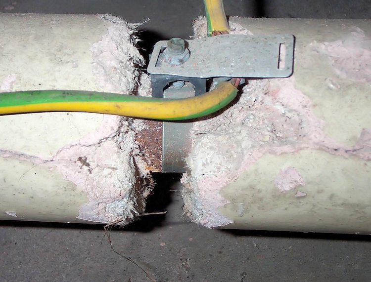 Asbestos insulation damaged from earth strap