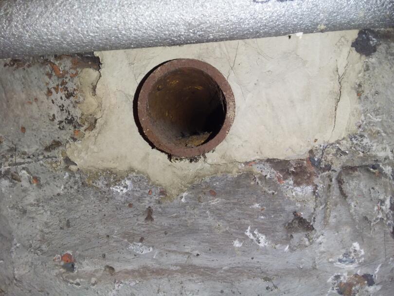 Asbestos insulation debris / snots around pipe penetration from previously hand applied asbestos lagging