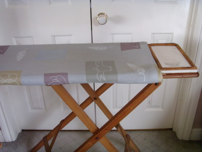 Asbestos panel used as heat protector on ironing board