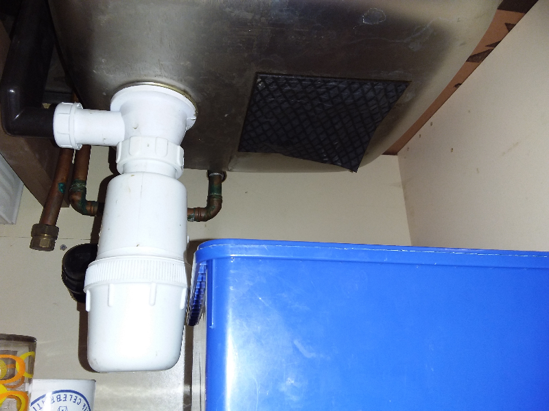Asbestos sink pad to underside of sink