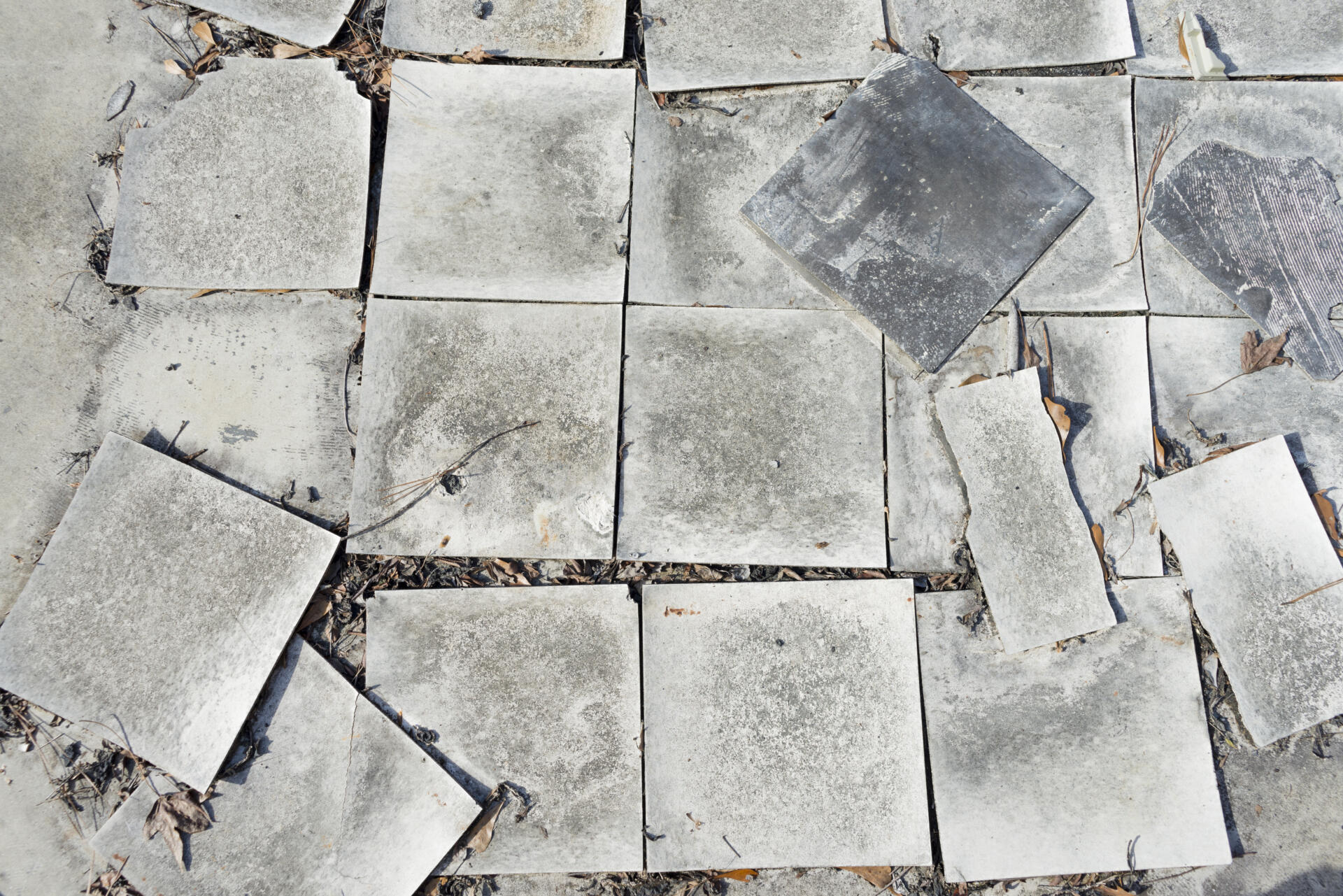 Damaged asbestos vinyl floor tiles
