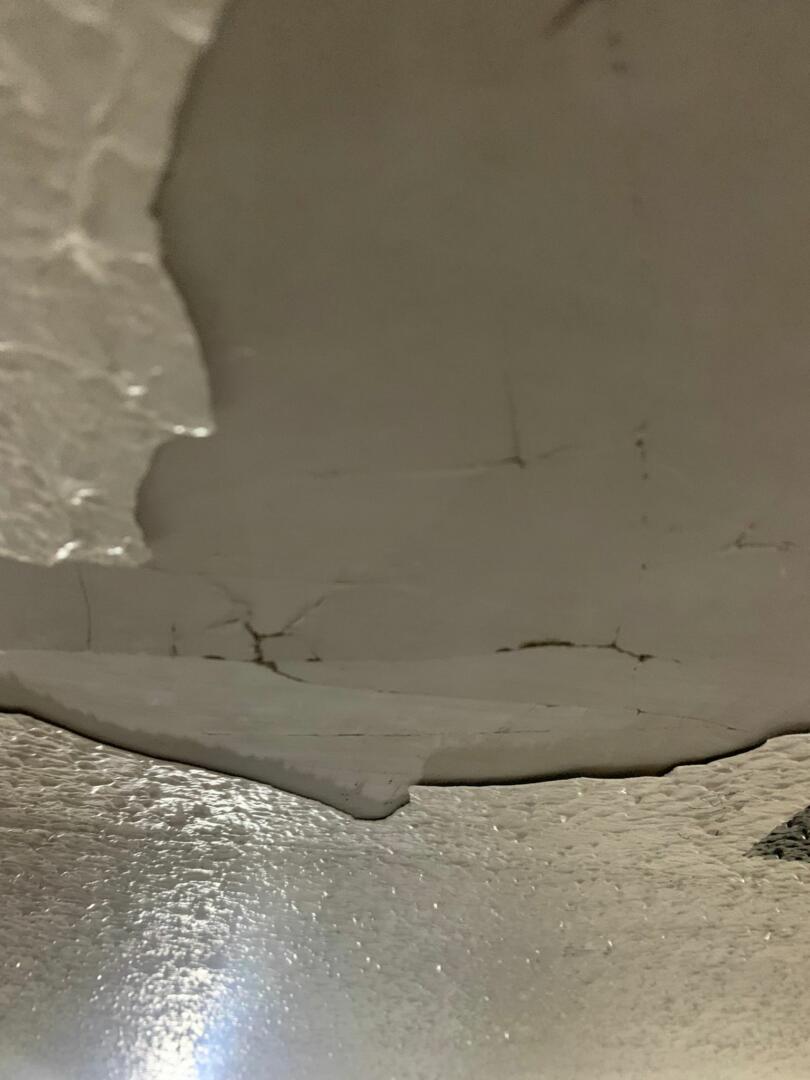 Damaged flaky asbestos containing artex