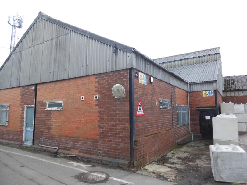 Asbestos cement wall and roof sheets on industrial factory building