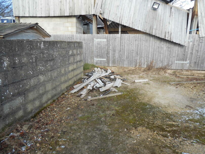 Pile of asbestos cement following collapse of building