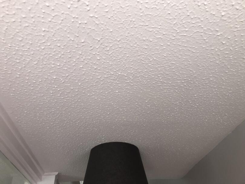 Asbestos artex ceiling in store room in house