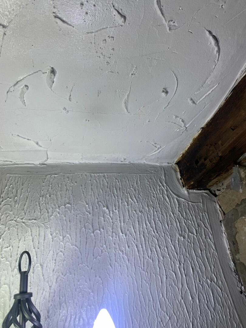 Various asbestos containing artex patterns on ceiling and walls