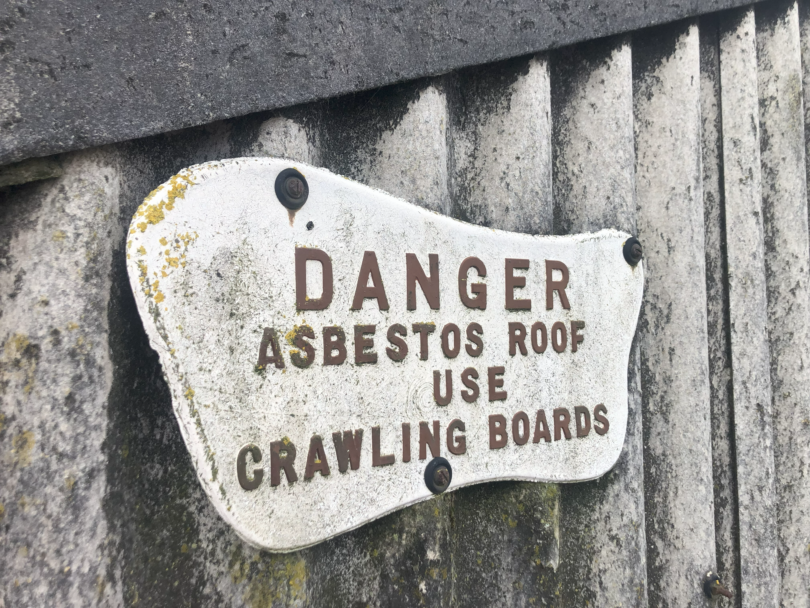 Warning sign on asbestos roof