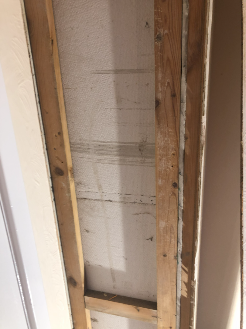 Asbestos insulating board pipe boxing in bedroom