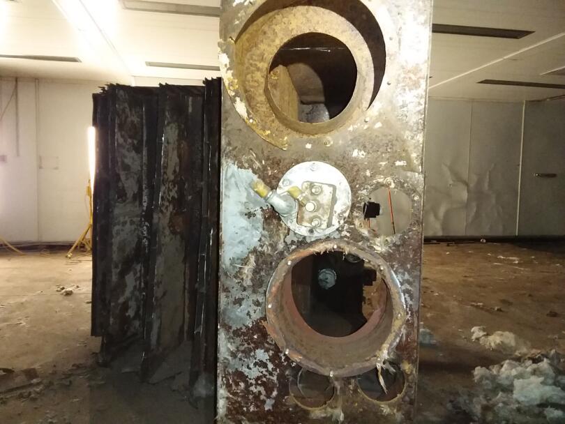 Asbestos woven rope seal debris around old oven