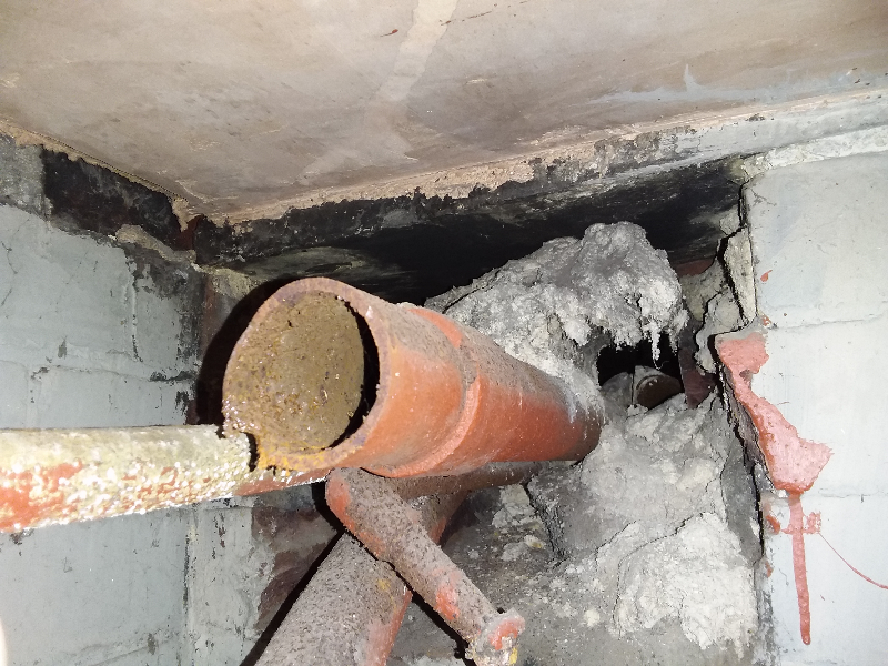Asbestos insulation around pipe penetration