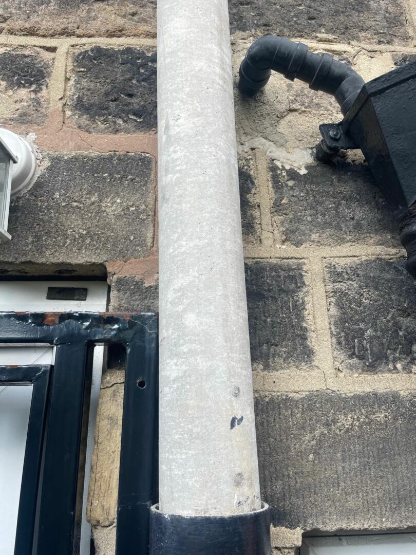 Asbestos flue pipe on domestic property