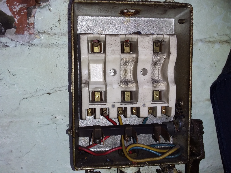 Asbestos fuse guard in old electrical fuse board
