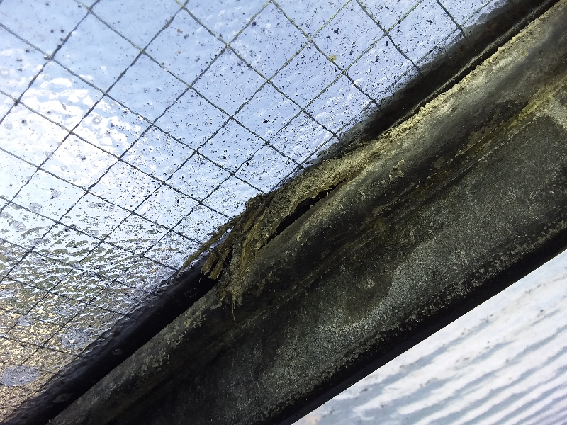 Close up of asbestos rope seal used in on external roof windows