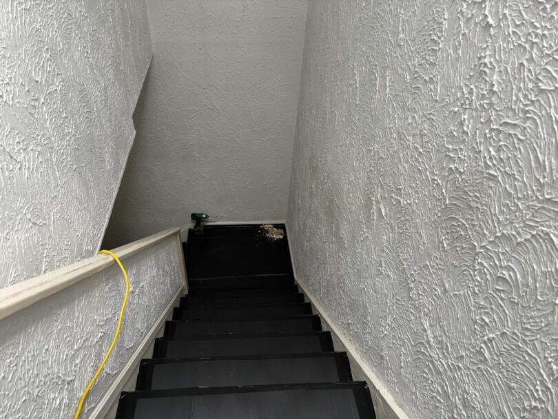 Artex containing asbestos on staircase walls and ceiling